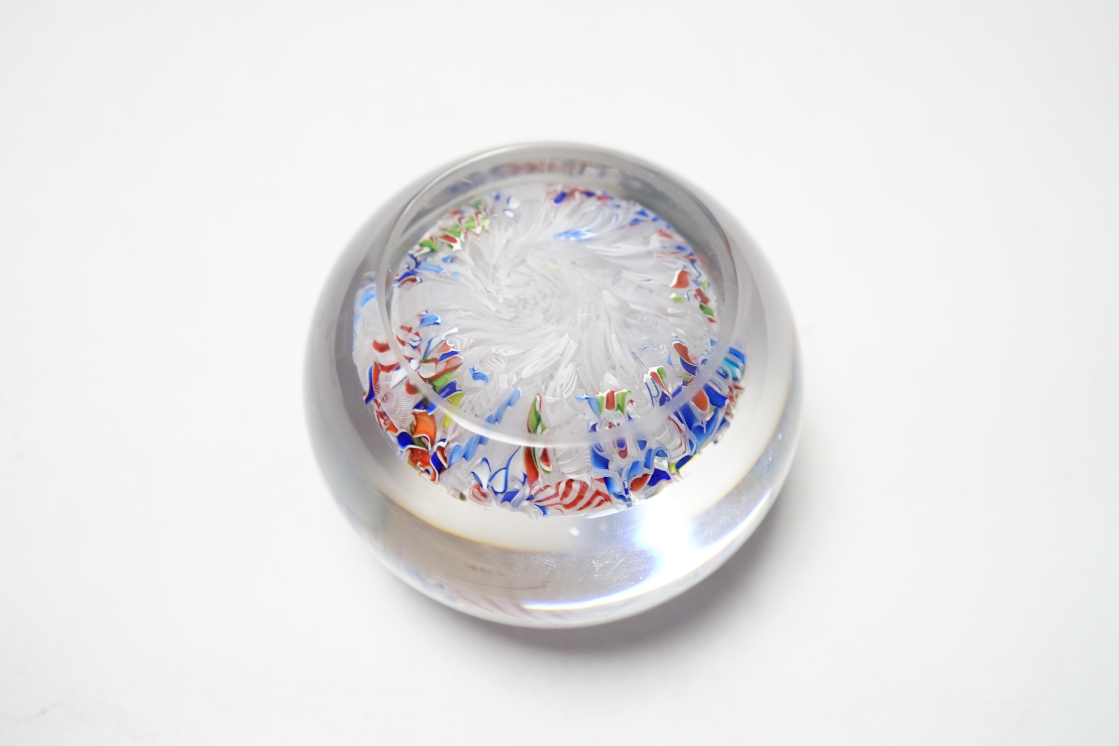 A St Louis paperweight with dog silhouette amid scrambled canes, 8cm diameter